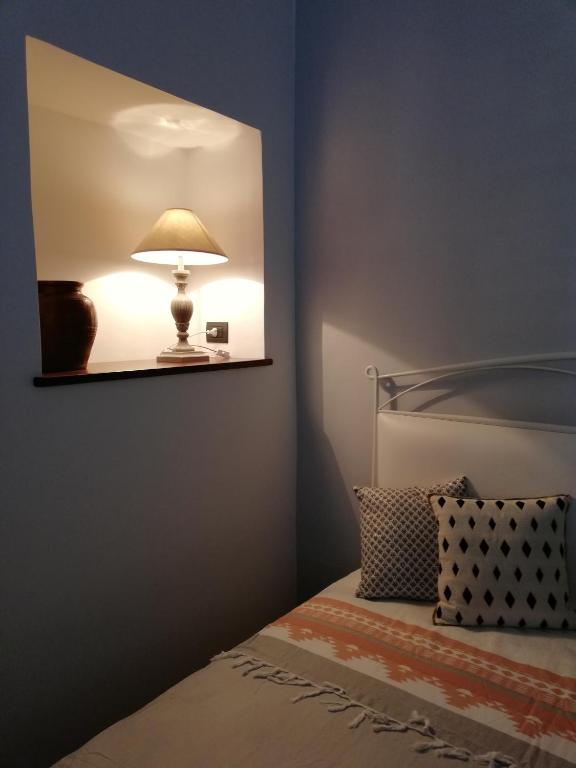 Postel nebo postele na pokoji v ubytování Agorà Suites & Apartments