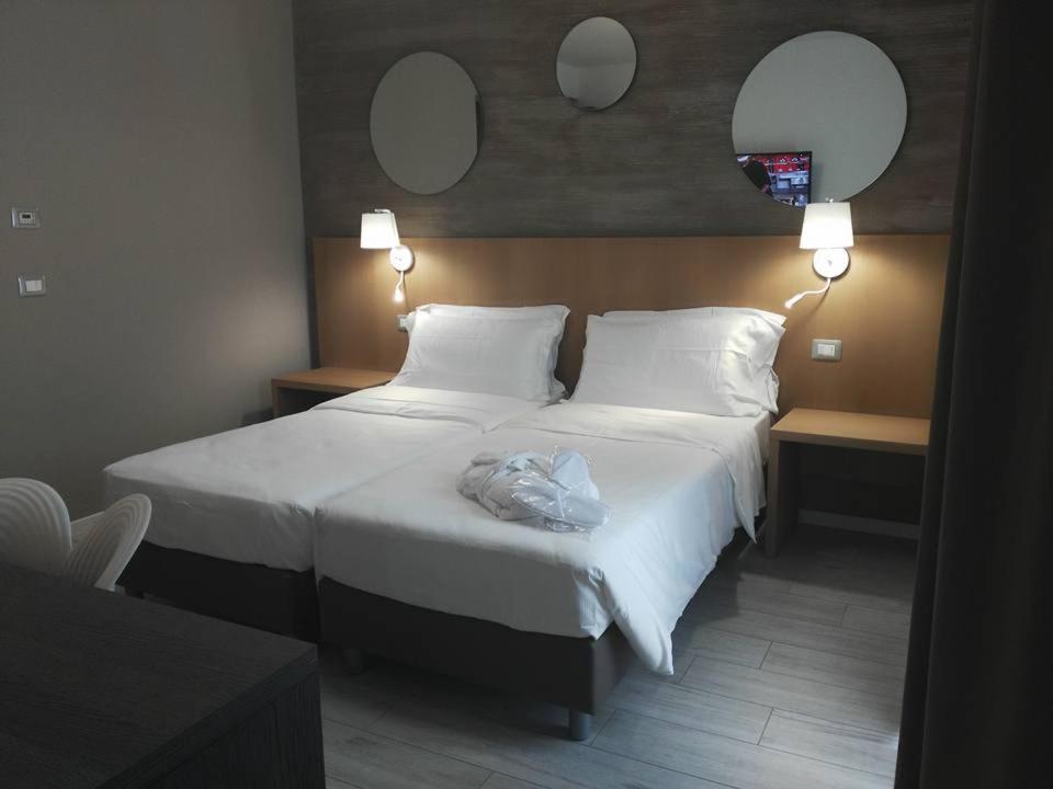 Postel nebo postele na pokoji v ubytování Hotel Lily