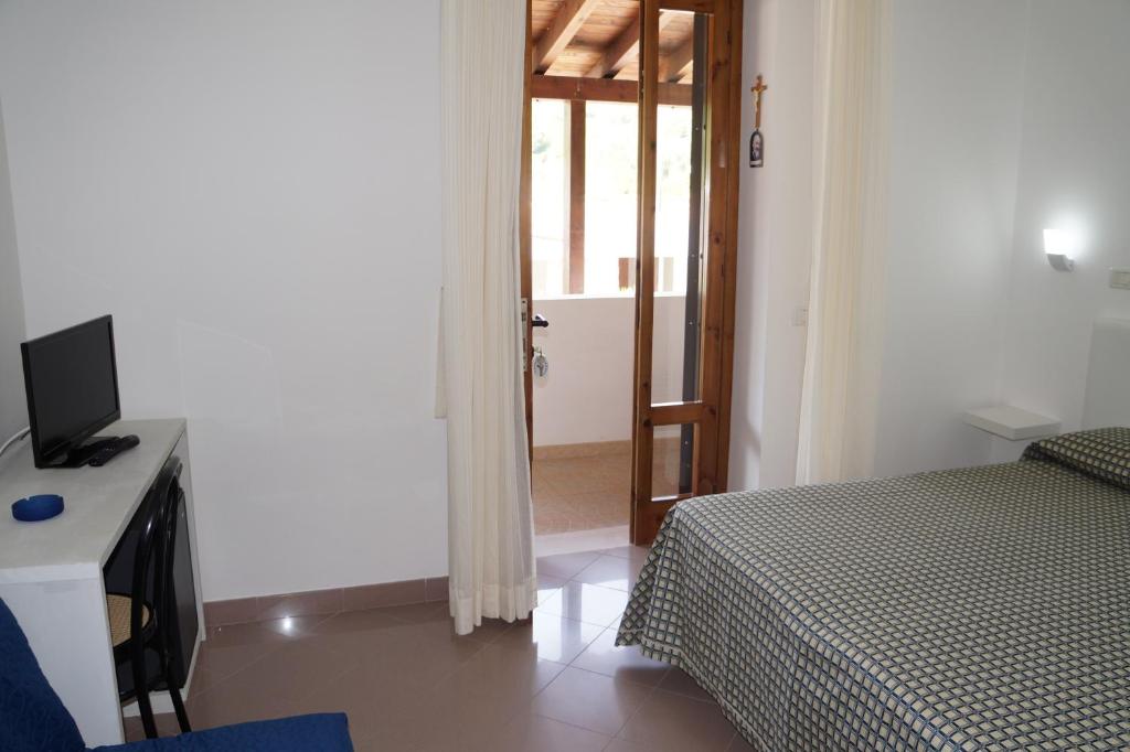 Postel nebo postele na pokoji v ubytování Hotel Parco Carabella