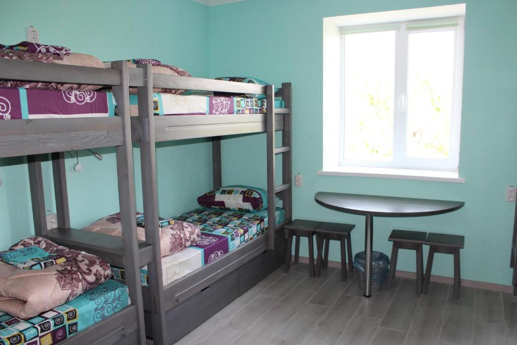Postel nebo postele na pokoji v ubytování Мини отель,Хостел Кенгуру
