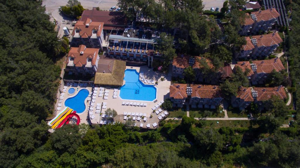 an overhead view of a large house with a swimming pool at Pine Valley Hotel Oludeniz in Oludeniz