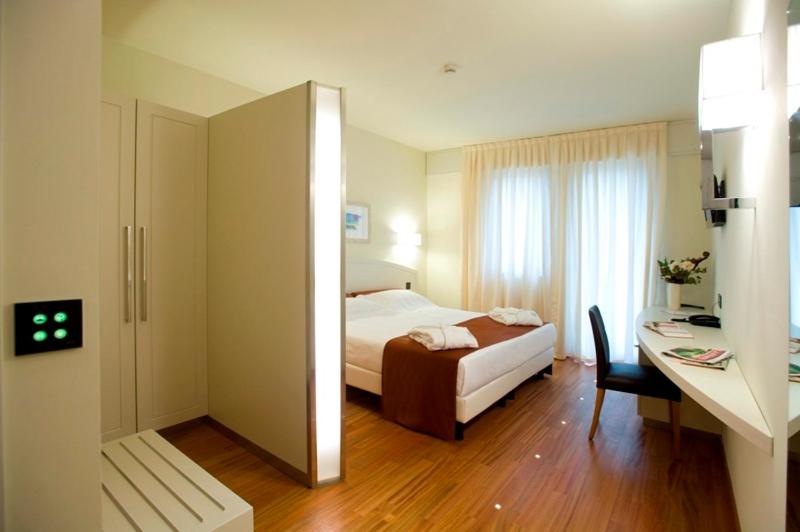 Postel nebo postele na pokoji v ubytování Hotel Napoleon