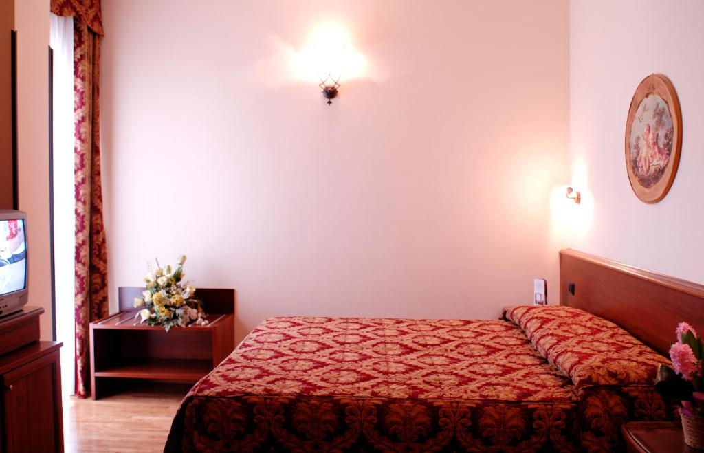 Łóżko lub łóżka w pokoju w obiekcie Hotel HDomus