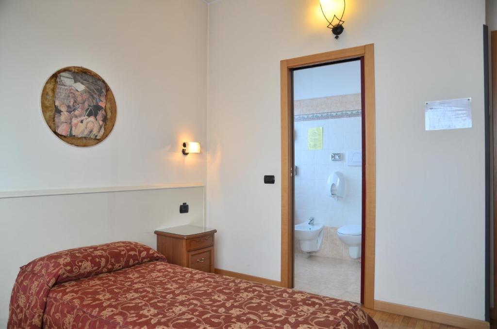 Łóżko lub łóżka w pokoju w obiekcie Hotel HDomus