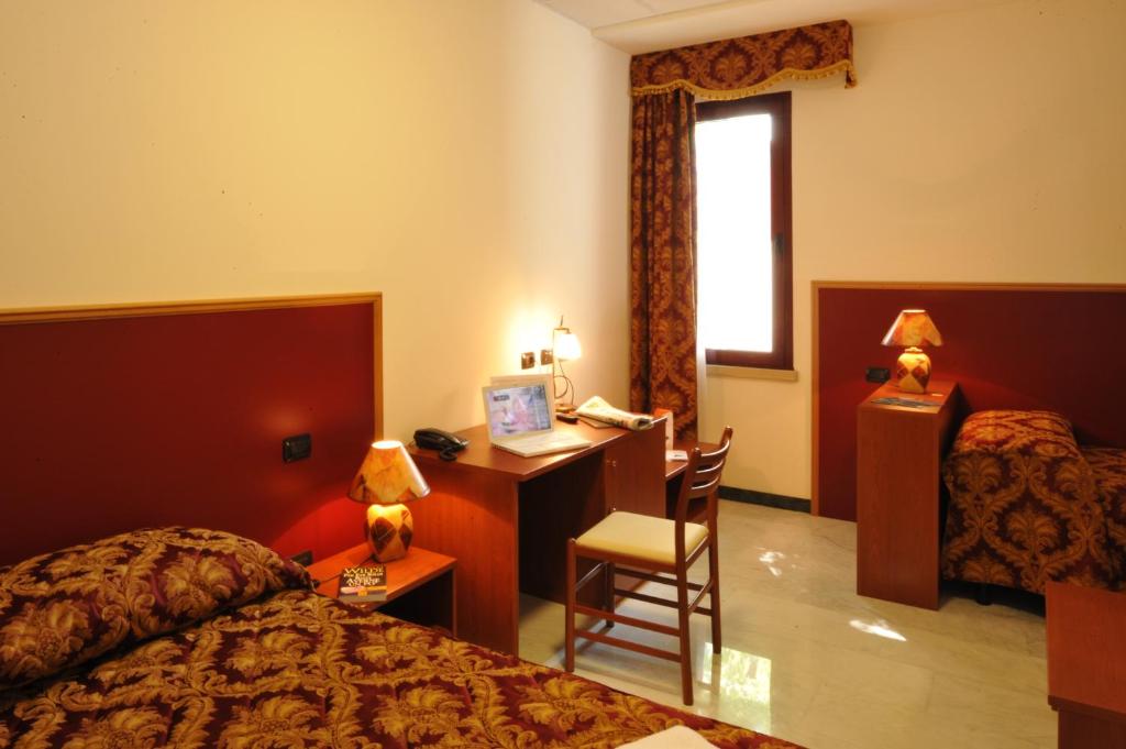 Łóżko lub łóżka w pokoju w obiekcie Hotel HDomus