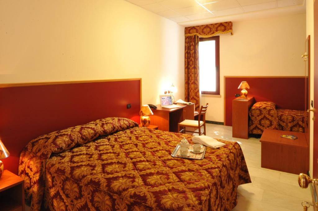 Łóżko lub łóżka w pokoju w obiekcie Hotel HDomus