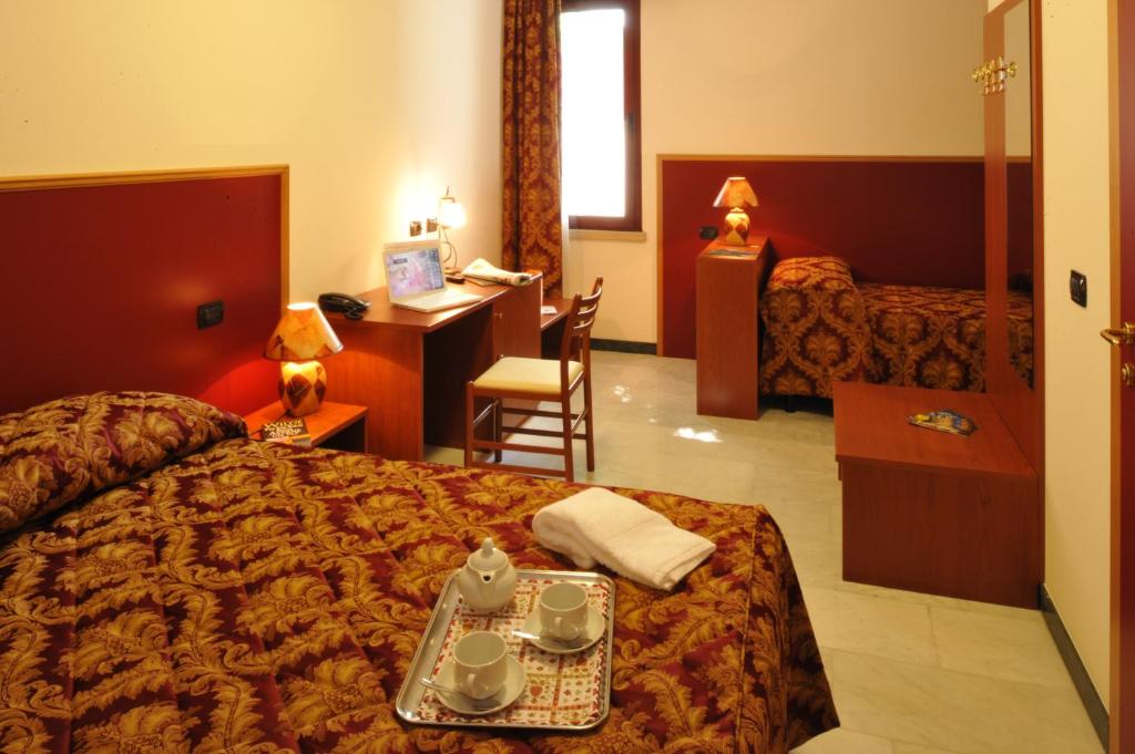 Łóżko lub łóżka w pokoju w obiekcie Hotel HDomus