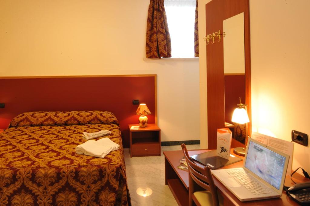 Łóżko lub łóżka w pokoju w obiekcie Hotel HDomus