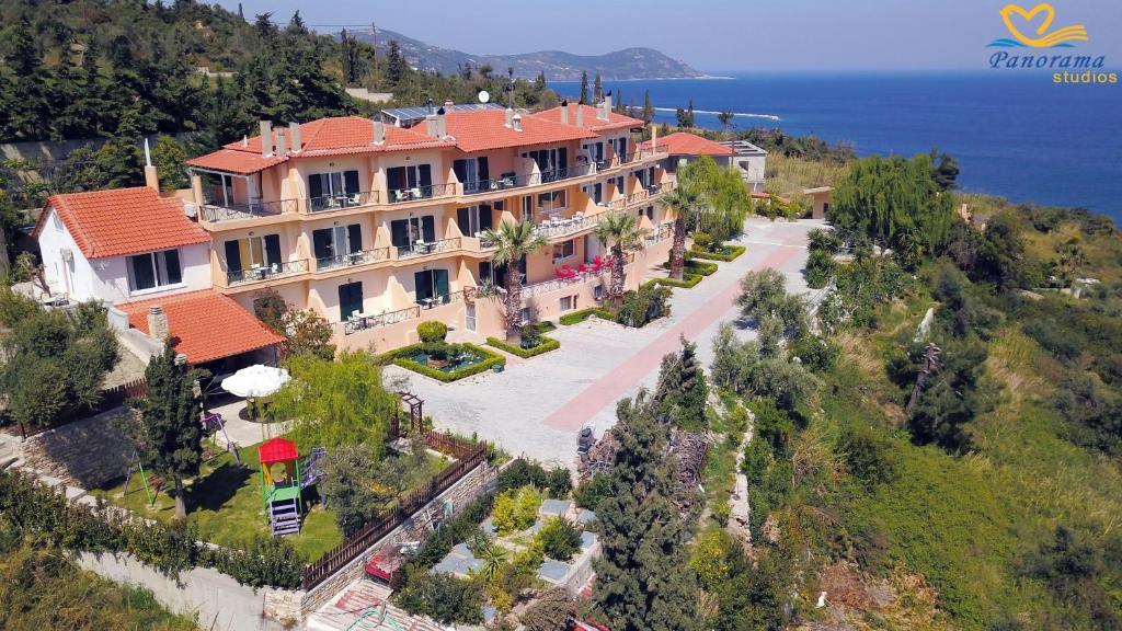 an aerial view of a large house on a hill at Panorama Hotel in Platána