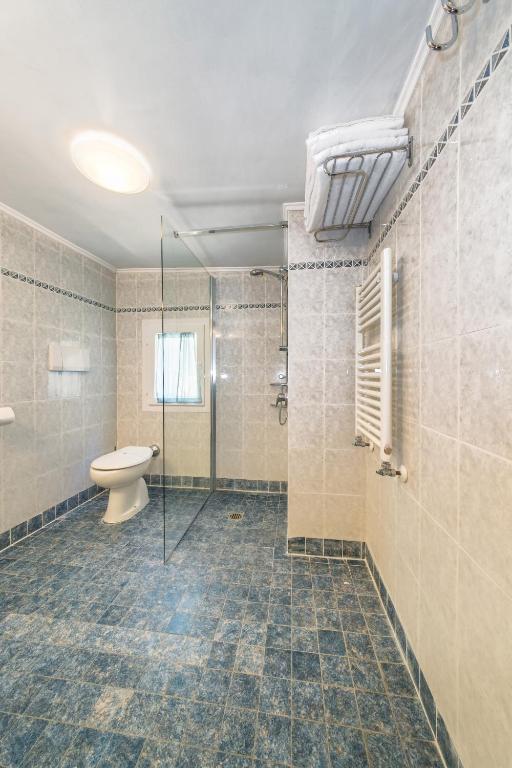 Koupelna v ubytování Hotel Pantalon