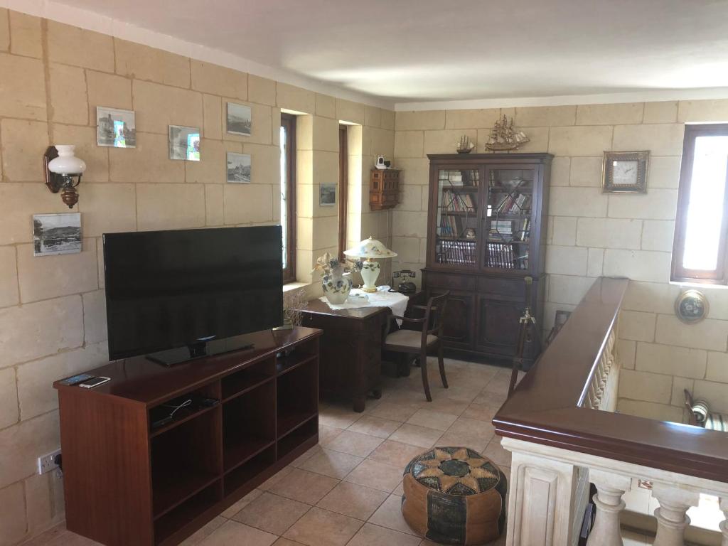 TV a/nebo společenská místnost v ubytování La Fenice by Giancarlo