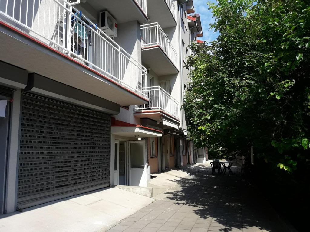 an empty alley between two buildings with a balcony at Studio S Sokobanja in Soko Banja