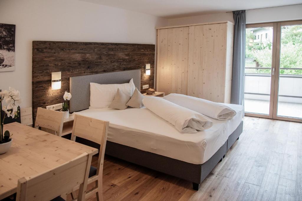 Postel nebo postele na pokoji v ubytování Appartement- und Wellnesshotel Winkler