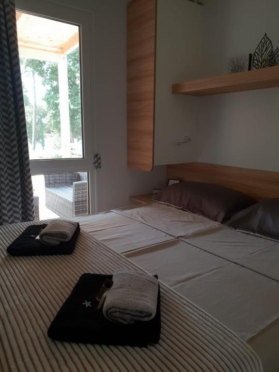 Postel nebo postele na pokoji v ubytování Seahorse Mobile Home, Soline Biograd