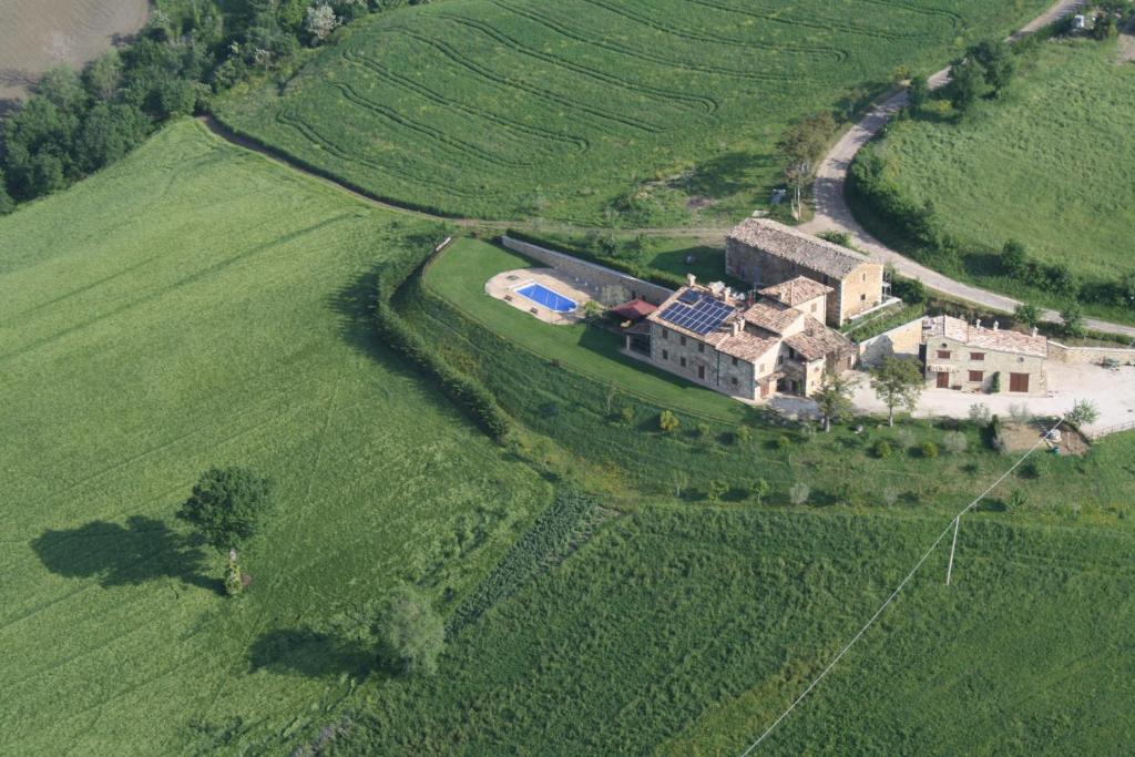 an aerial view of a house in the middle of a field at Bed & Breakfast Cà Riccio in Macerata Feltria