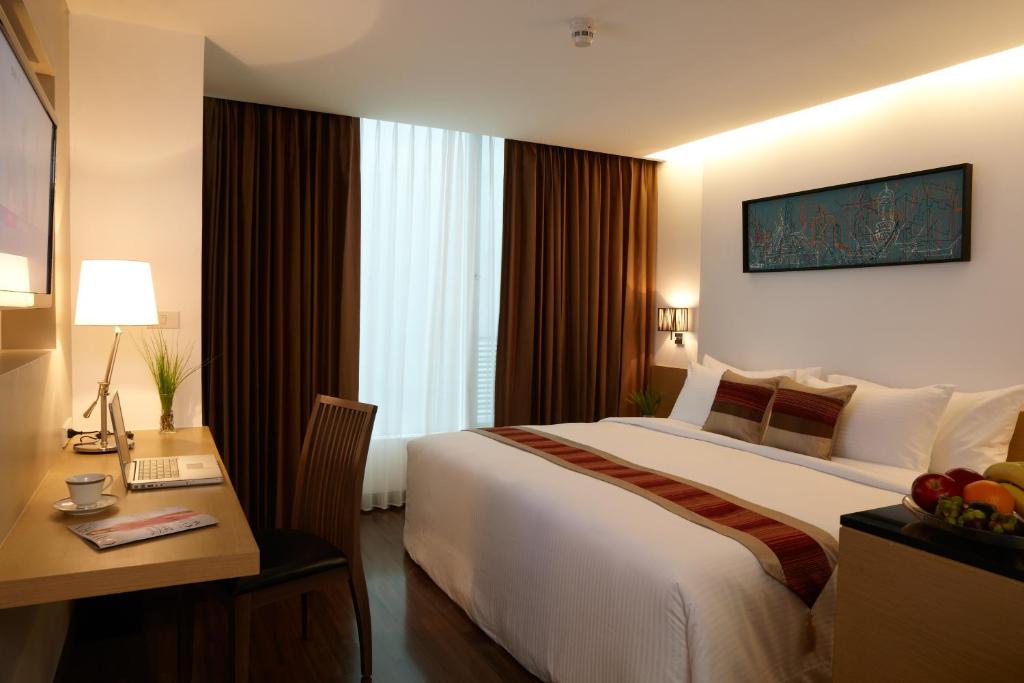 מיטה או מיטות בחדר ב-Citypoint Hotel