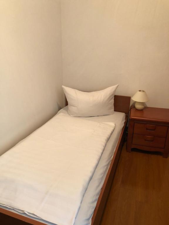 Postel nebo postele na pokoji v ubytování Hotel Südheide