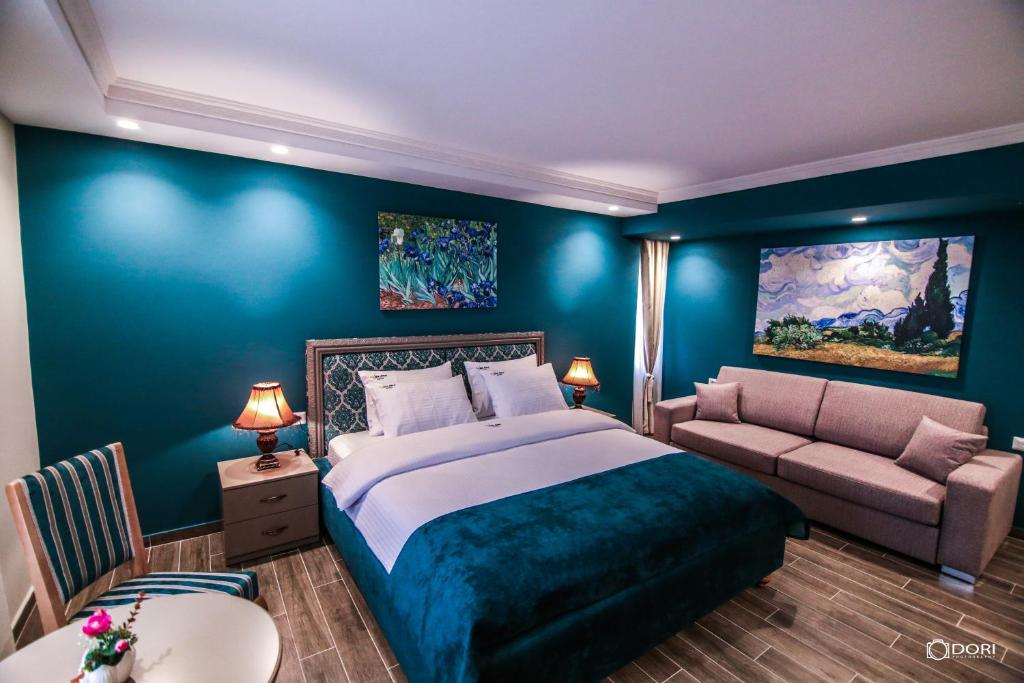 Postel nebo postele na pokoji v ubytování Hotel Restaurant Vila Ime Voskopoje