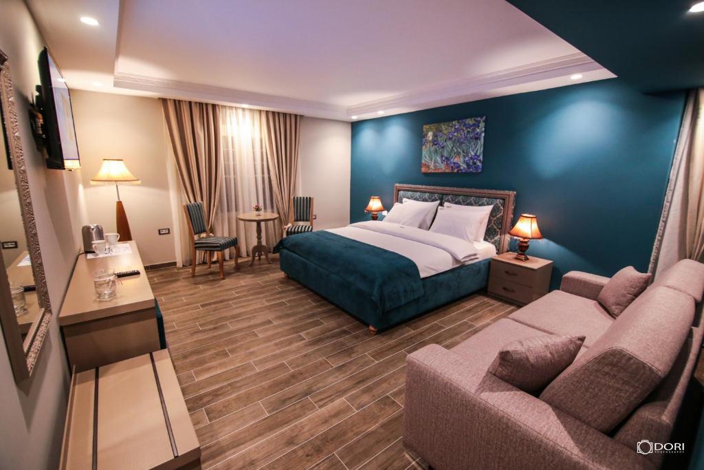 Postel nebo postele na pokoji v ubytování Hotel Restaurant Vila Ime Voskopoje