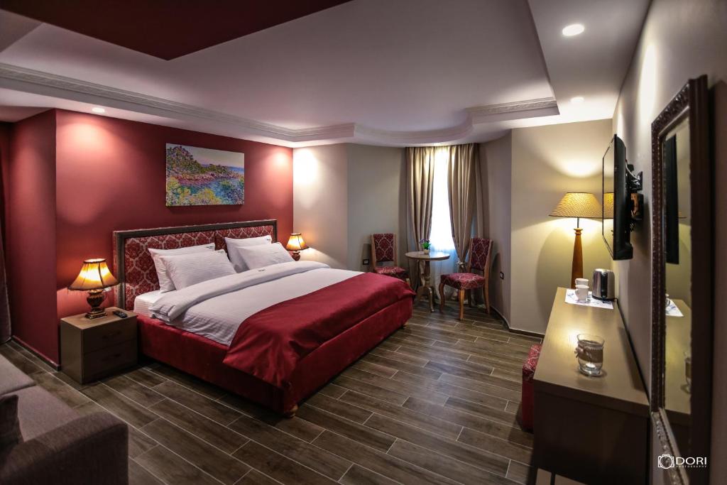 Postel nebo postele na pokoji v ubytování Hotel Restaurant Vila Ime Voskopoje