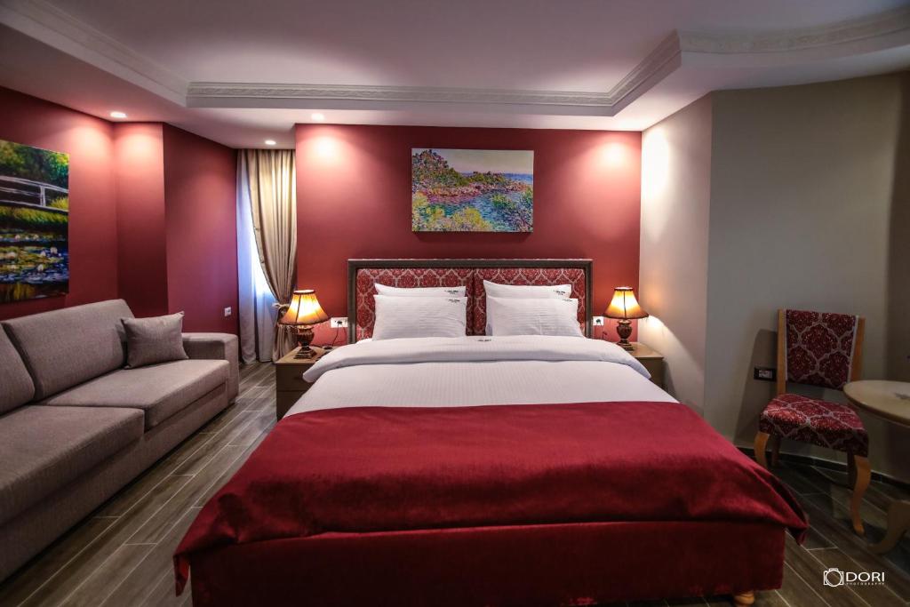 Postel nebo postele na pokoji v ubytování Hotel Restaurant Vila Ime Voskopoje