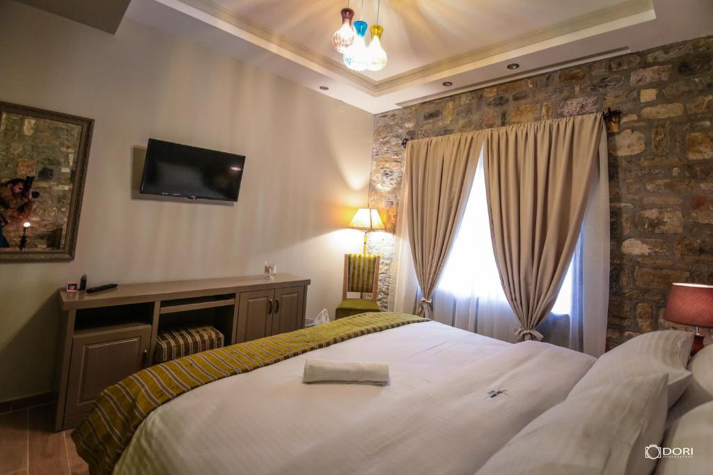 Postel nebo postele na pokoji v ubytování Hotel Restaurant Vila Ime Voskopoje