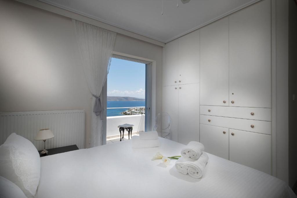 Postel nebo postele na pokoji v ubytování Sounio Villa