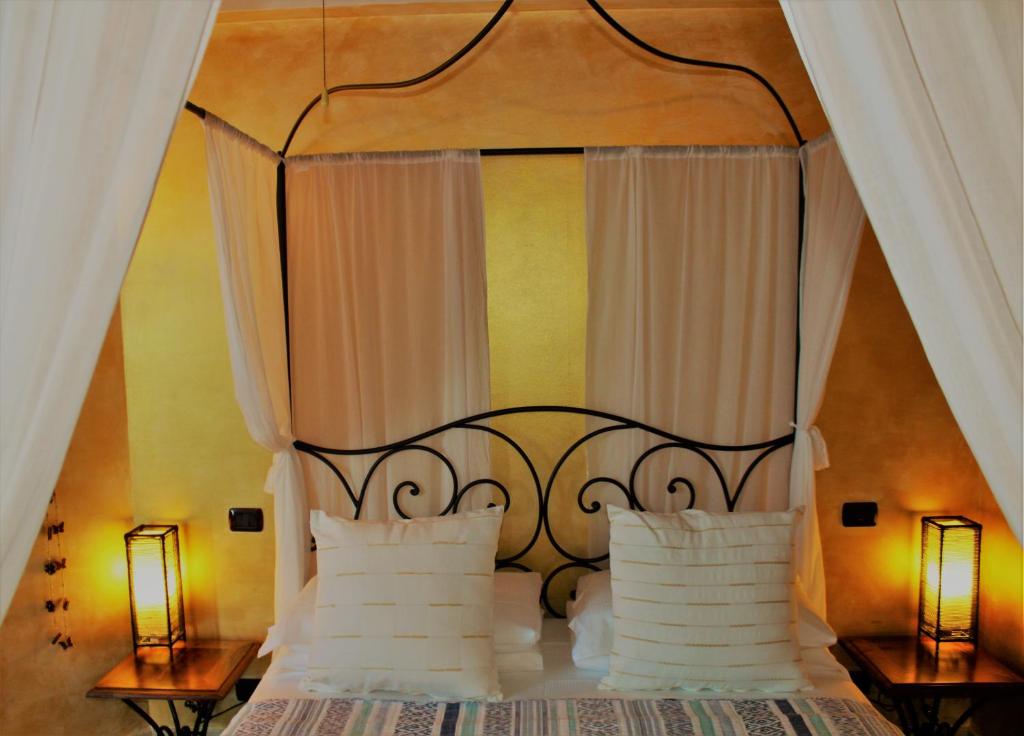 Postel nebo postele na pokoji v ubytování Antigua B&B