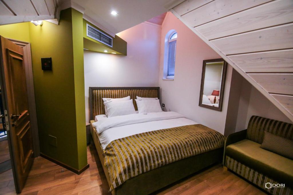 Postel nebo postele na pokoji v ubytování Hotel Restaurant Vila Ime Voskopoje