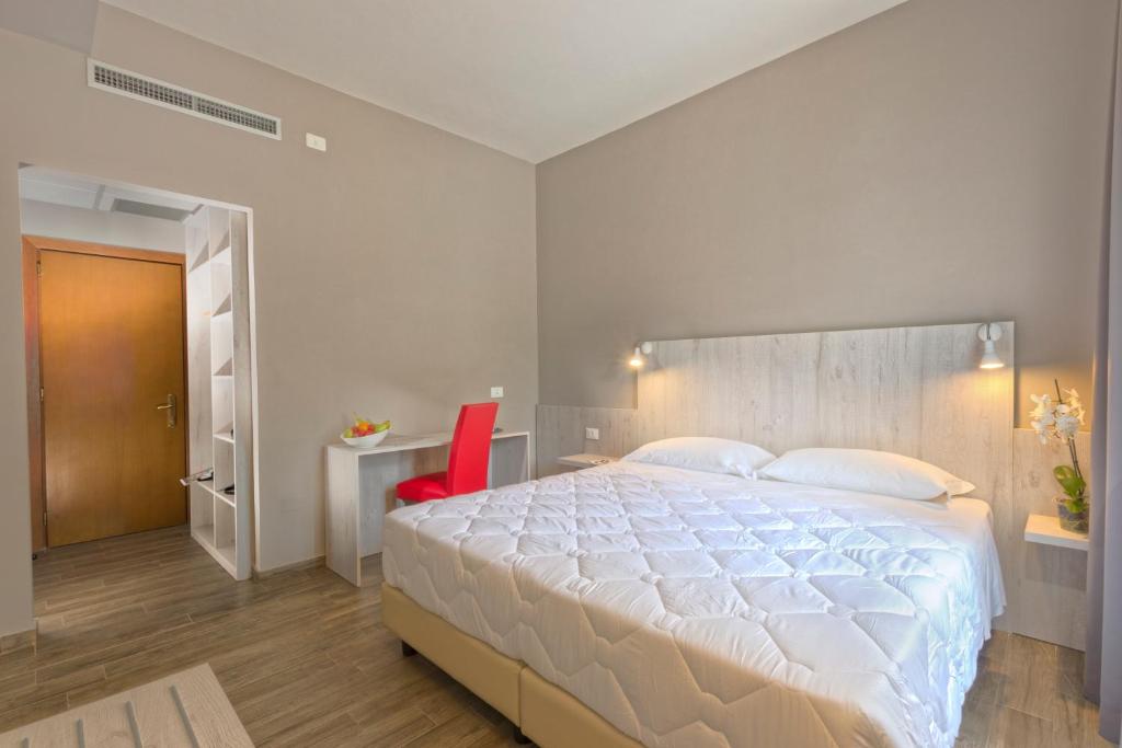 Postel nebo postele na pokoji v ubytování Hotel Terme di Frasassi