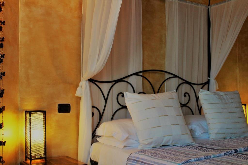 Postel nebo postele na pokoji v ubytování Antigua B&B