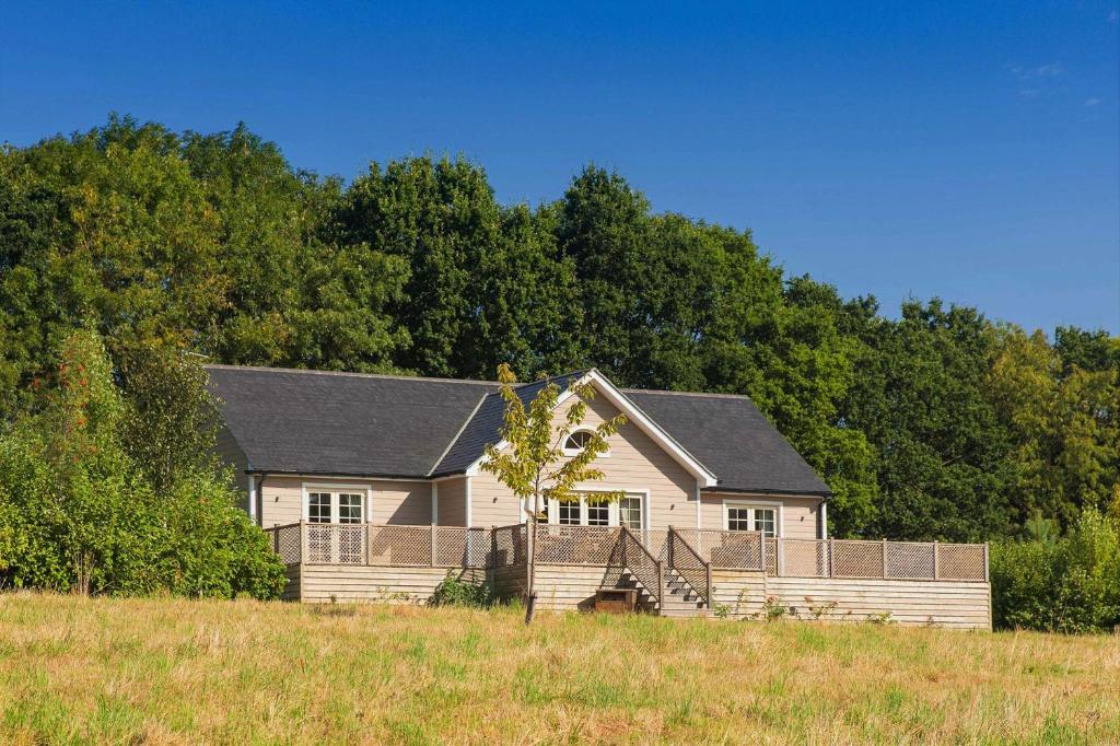 a house in the middle of a field at Endymion Lodge in Colchester