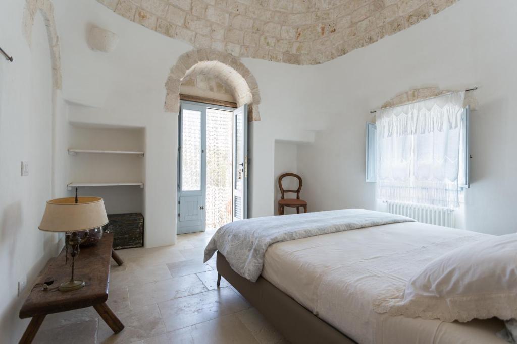 Postel nebo postele na pokoji v ubytování Si Fa Trullo