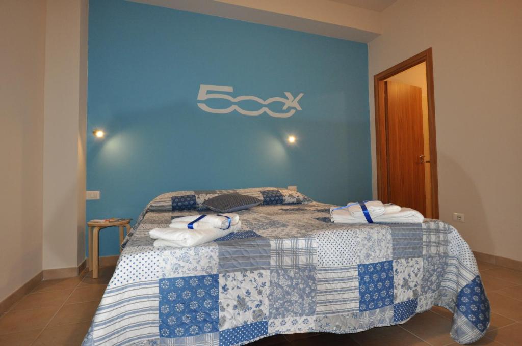 Postel nebo postele na pokoji v ubytování b&b la vecchia 500