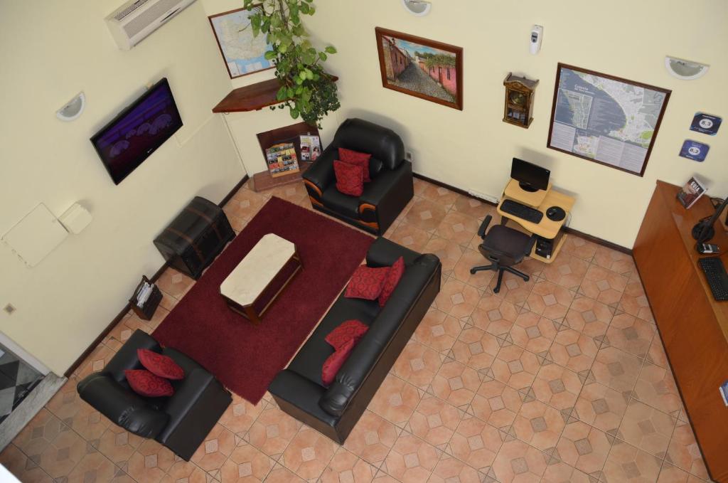 Télévision ou salle de divertissement dans l'établissement Hotel Romi