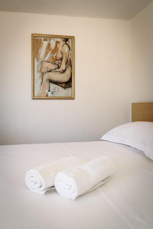 Posteľ alebo postele v izbe v ubytovaní Apartments Kudelik