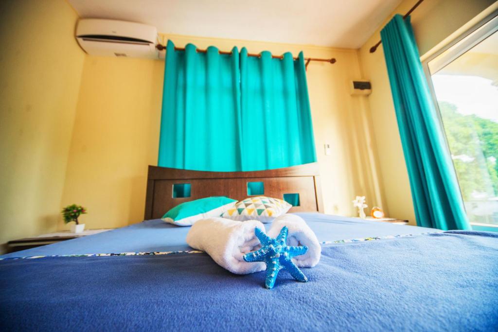 Postel nebo postele na pokoji v ubytování Case Latanier