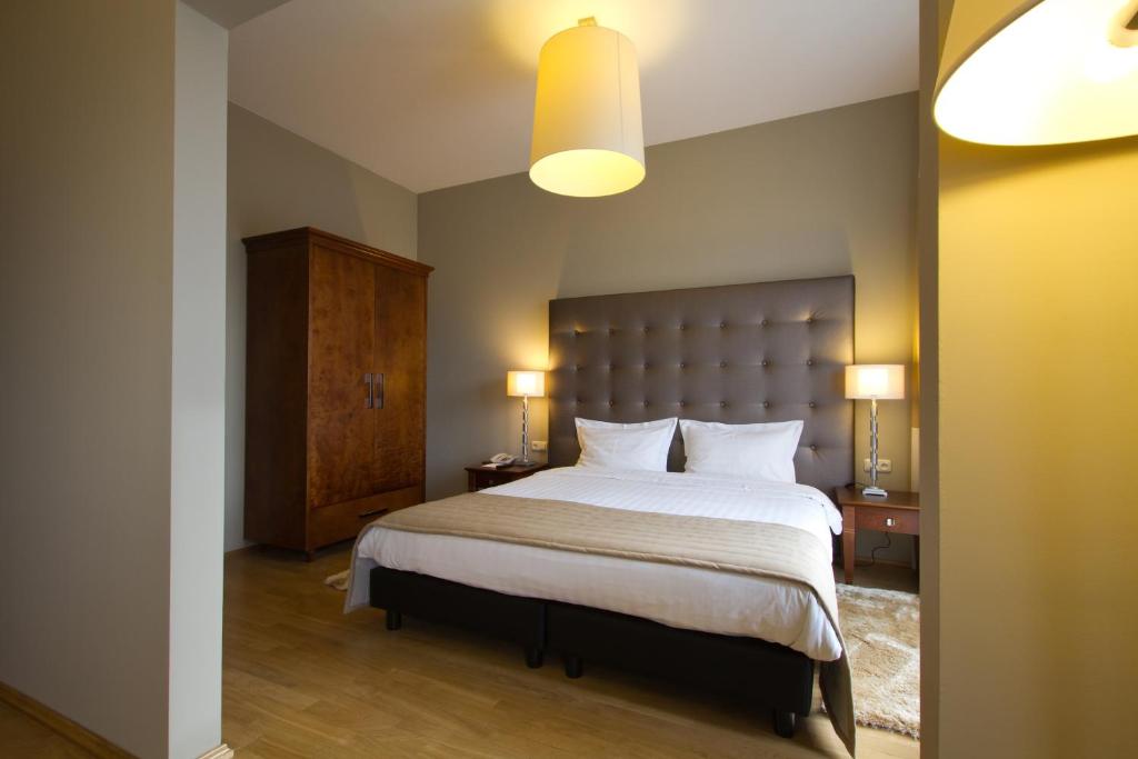 Posteľ alebo postele v izbe v ubytovaní Don Prestige Residence