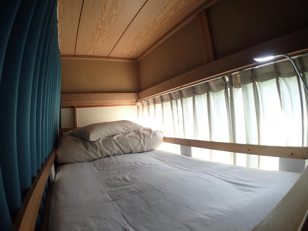 Postel nebo postele na pokoji v ubytování Guesthouse SORA