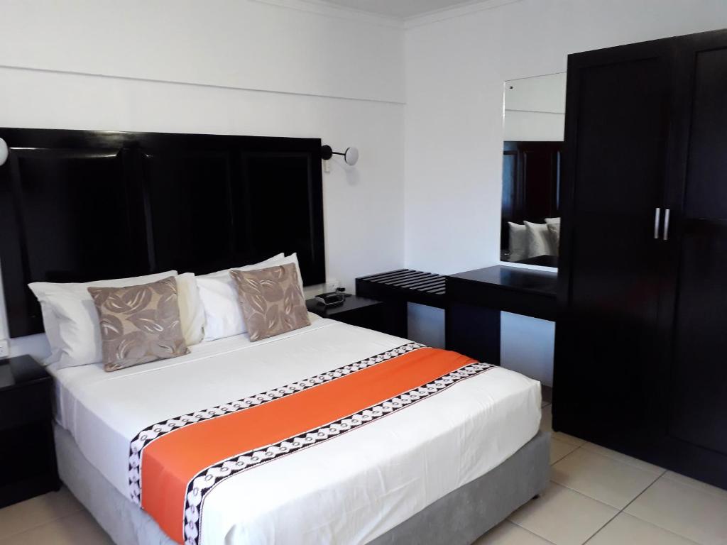 Postel nebo postele na pokoji v ubytování Suva Motor Inn