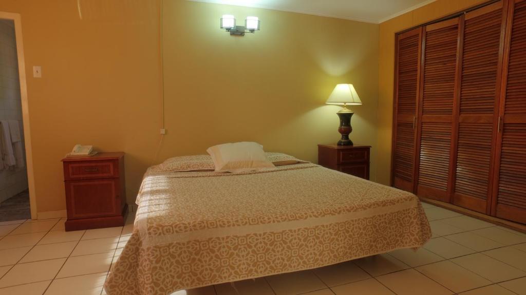 Postel nebo postele na pokoji v ubytování Coconut Inn