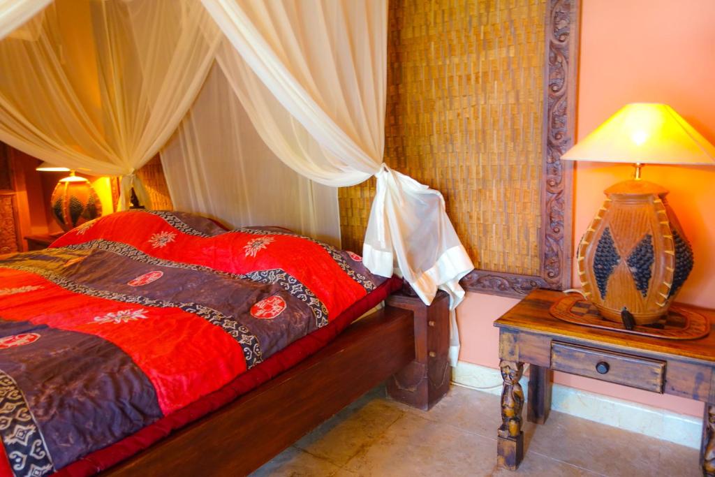 Postel nebo postele na pokoji v ubytování Medana Resort Lombok
