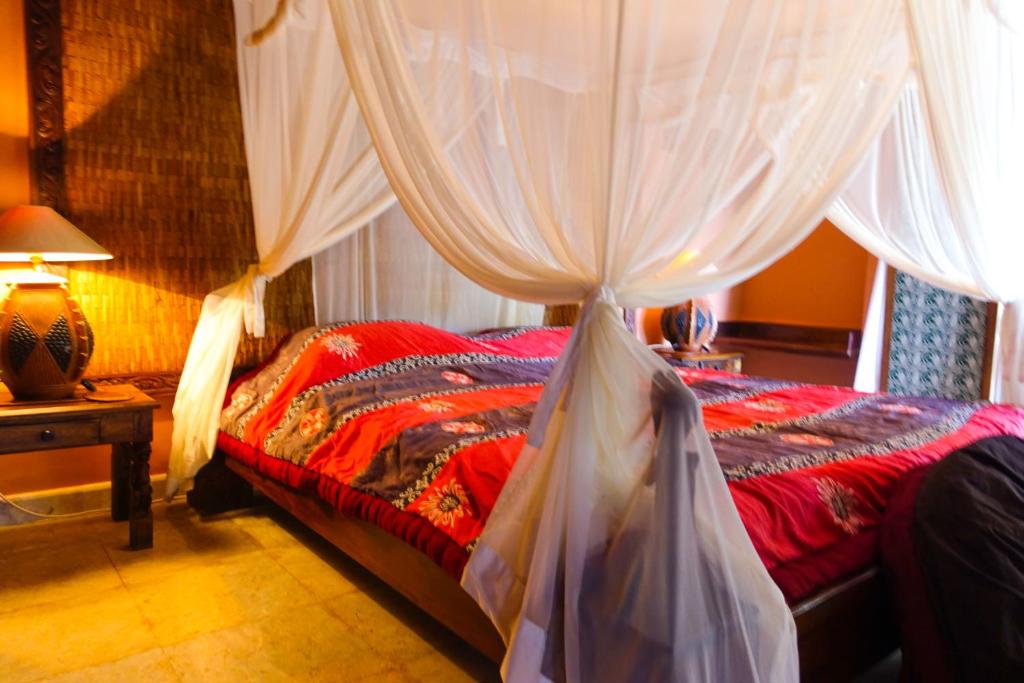 Postel nebo postele na pokoji v ubytování Medana Resort Lombok