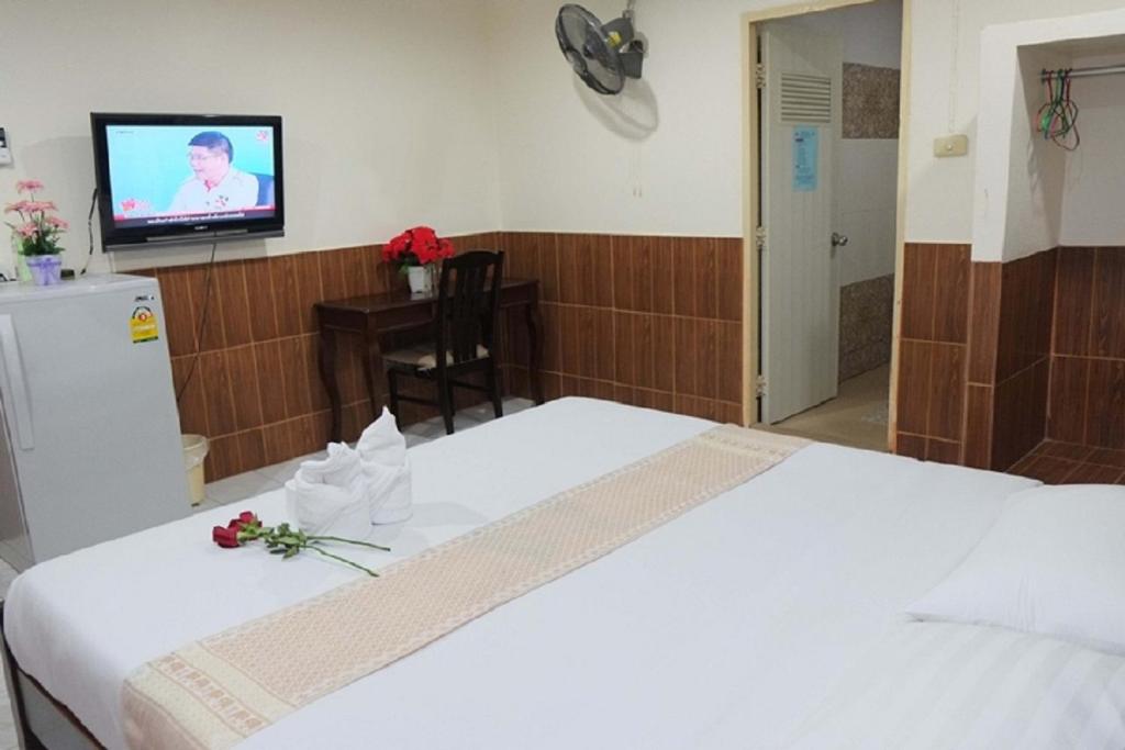 Postel nebo postele na pokoji v ubytování The Siam Guest House - SHA Extra Plus