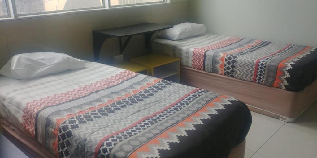 Postel nebo postele na pokoji v ubytování Seaboard Hotel & Holiday Apartments