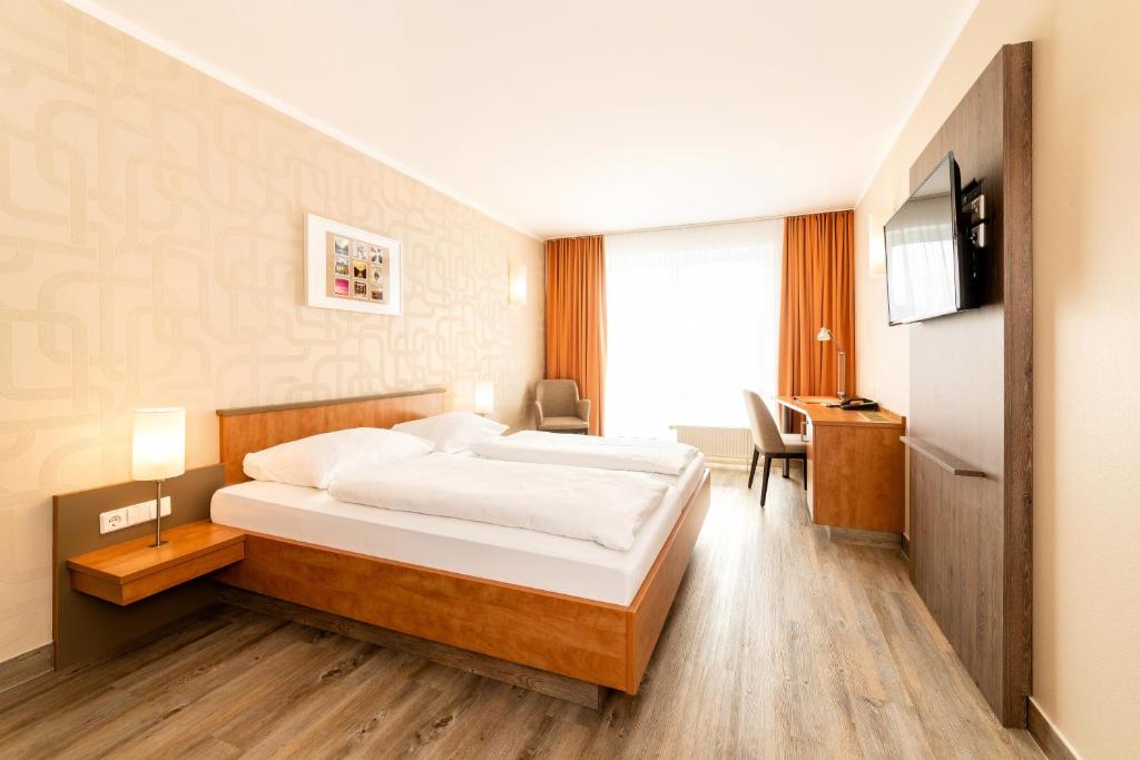 Postel nebo postele na pokoji v ubytování Hotel Spree-idyll