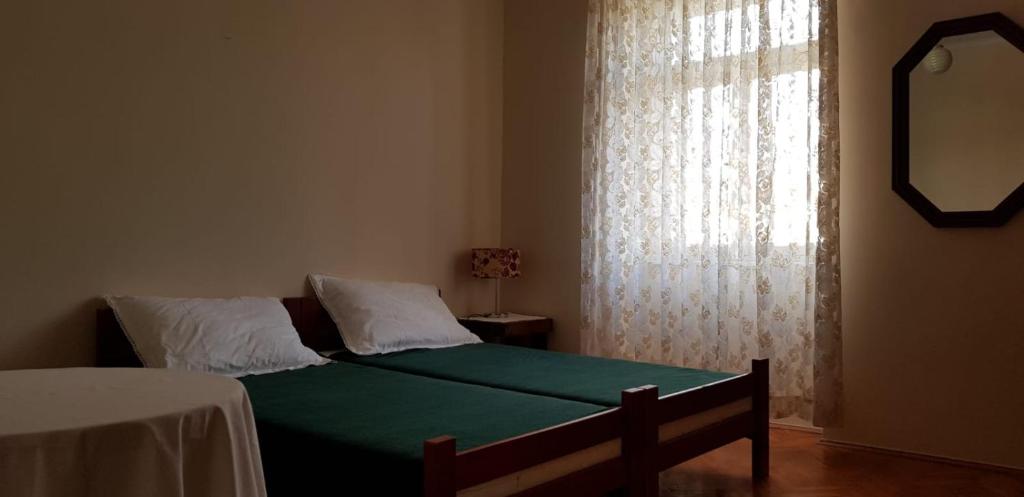 Postel nebo postele na pokoji v ubytování Sobe Zeneral