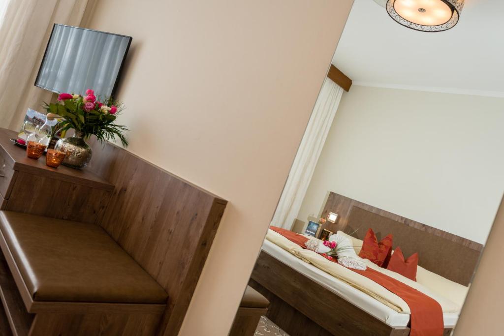 Postel nebo postele na pokoji v ubytování Hotel Sonnbichl