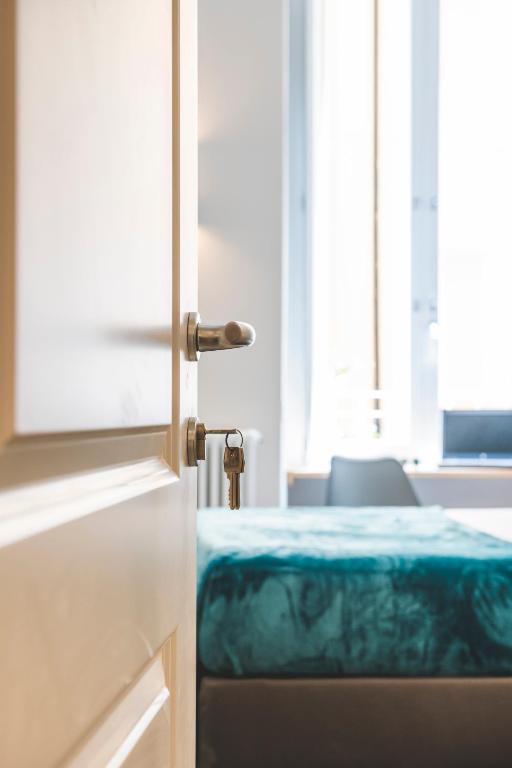 Posteľ alebo postele v izbe v ubytovaní Eccelso Hotel