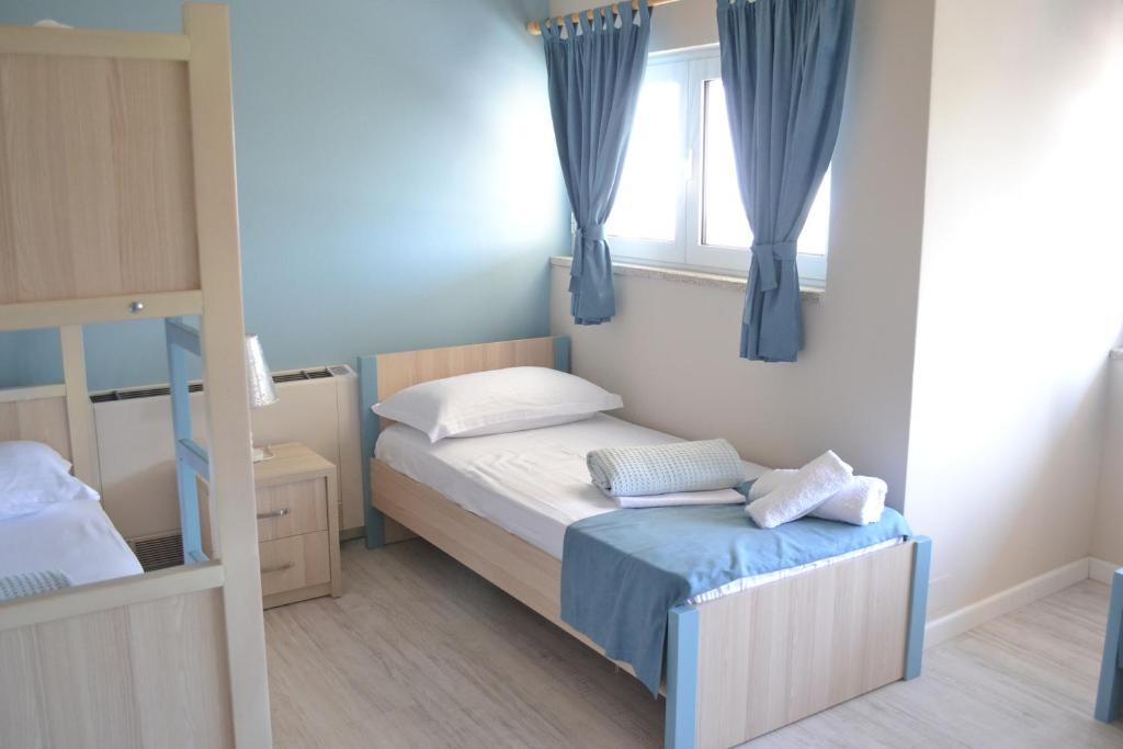 Postel nebo postele na pokoji v ubytování Open Doors Bed & Breakfast